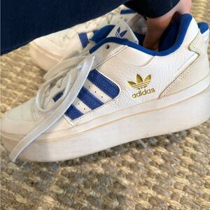 Adidas White Sneakers with Blue Stripes and Gold Logo